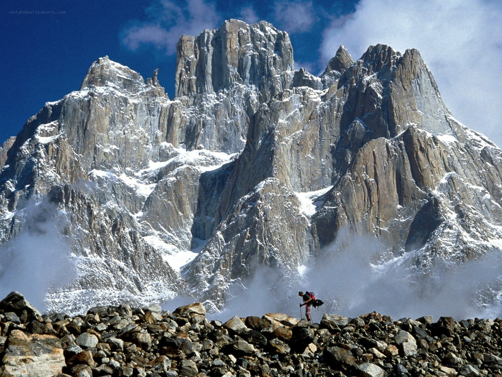 Hiker near a snow-capped mountain
