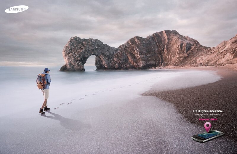 Hiker on a beach with arch