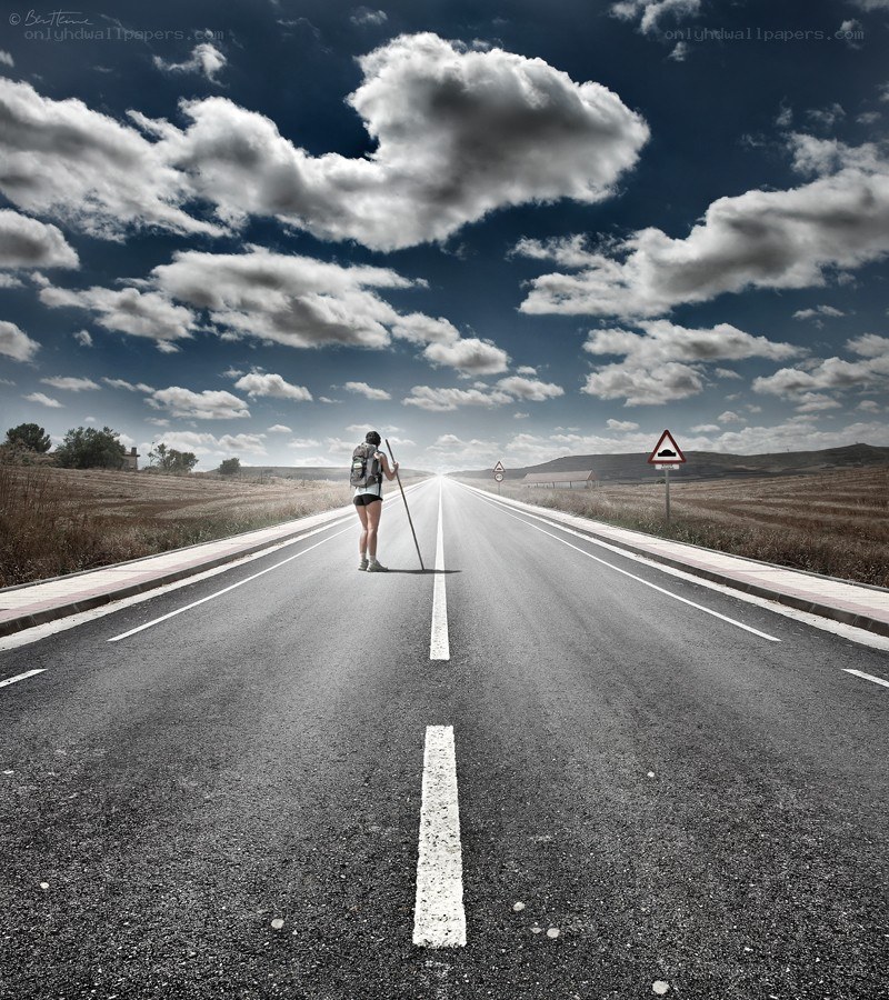 Hiker on a long road