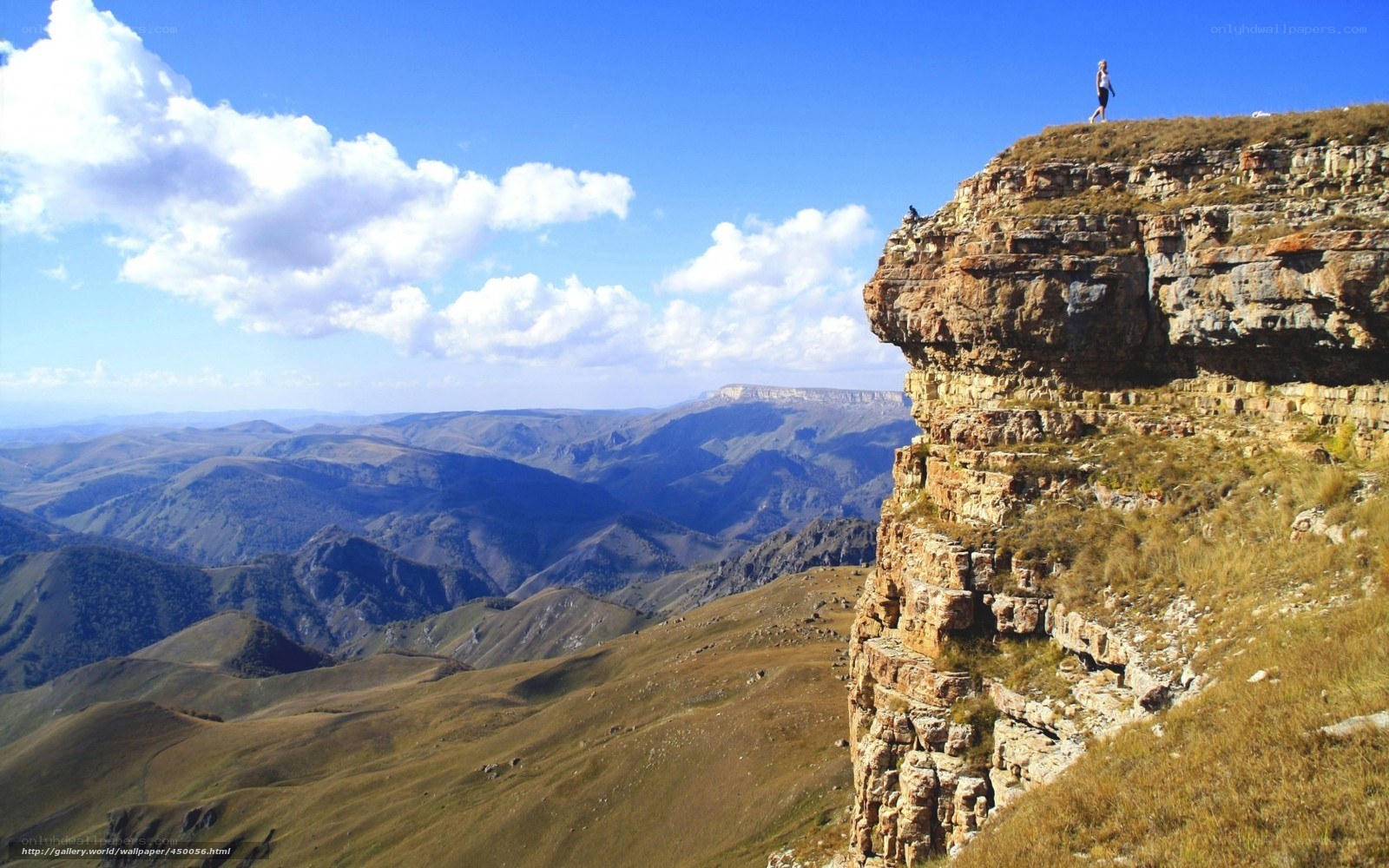 Hiker on a mountain cliff