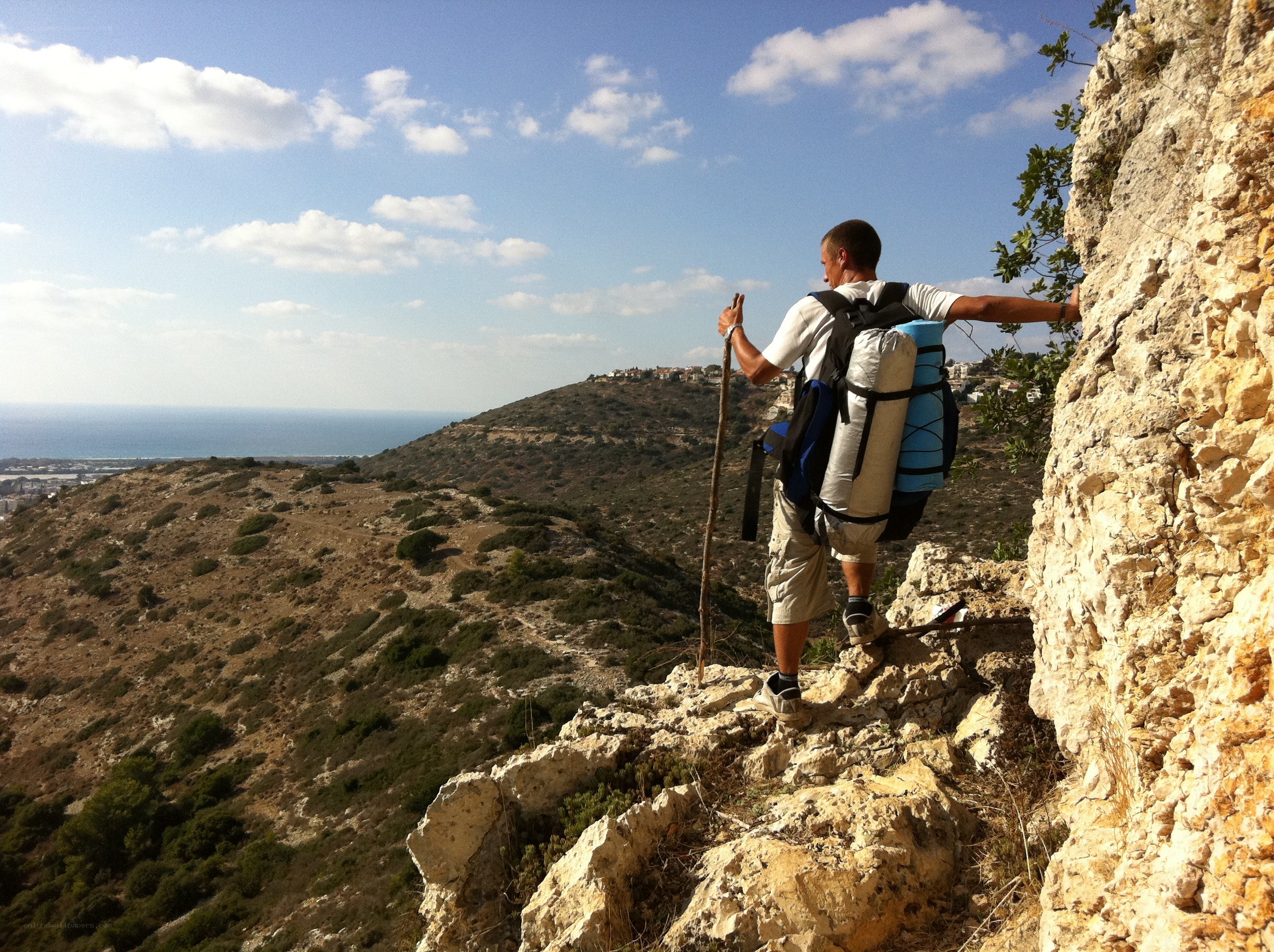 Hiker on a rocky cliff