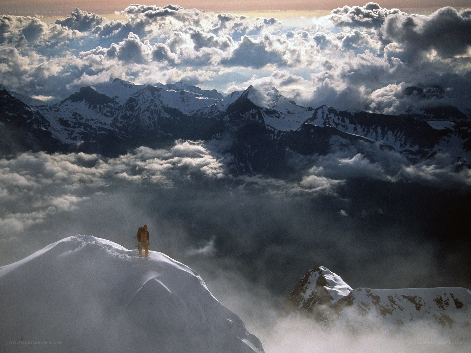 Hiker on a snowy peak