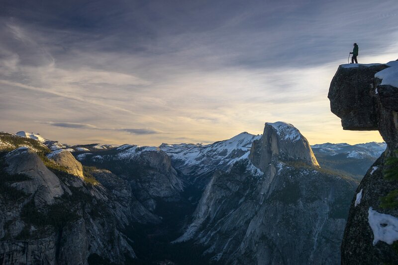 Hiker on Cliff Edge — Gray, Dramatic