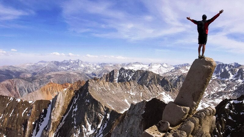 Hiker on Mountain Peak — Blue, Dramatic