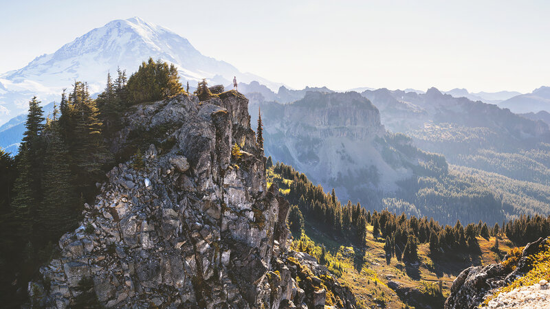Hiker on Mountain Peak — Gray, Serene