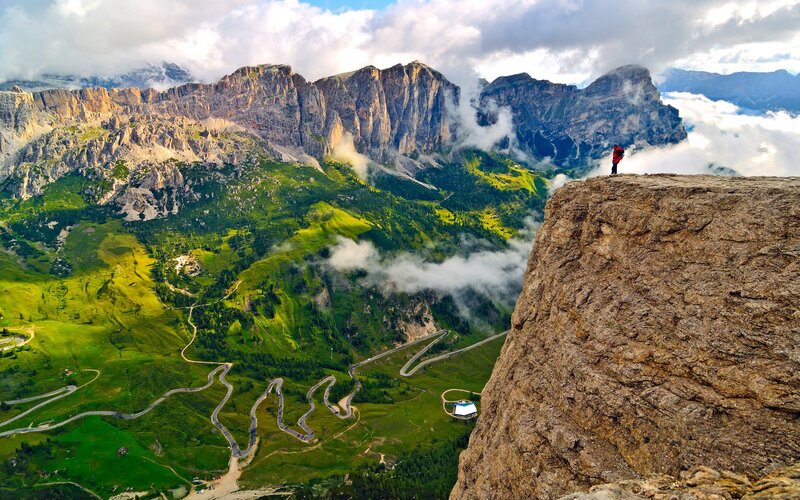 Hiker on Mountain Peak — Green, Dramatic