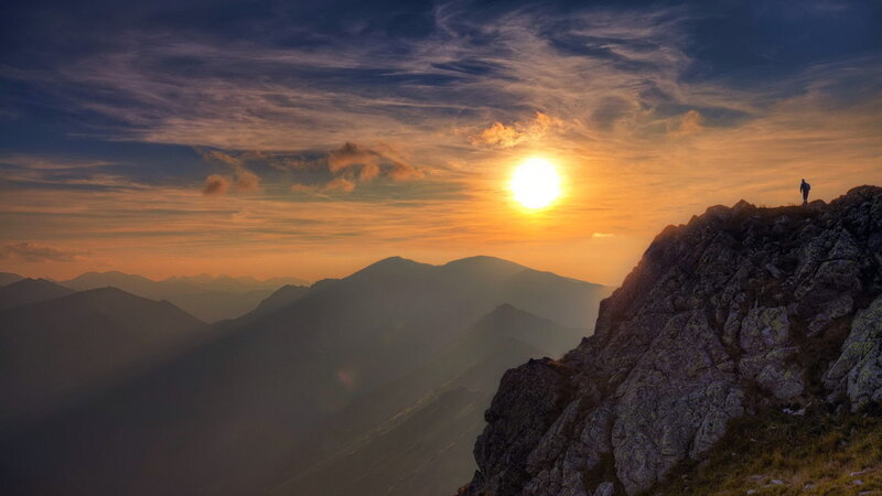 Hiker on Mountain Peak — Orange, Dramatic