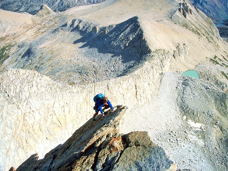 hiker on rocky mountain slope