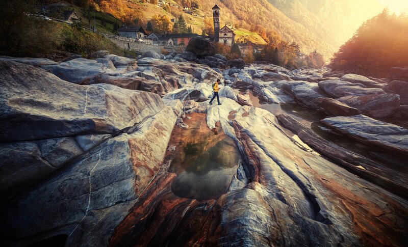 Hiker on Rocky Riverbed