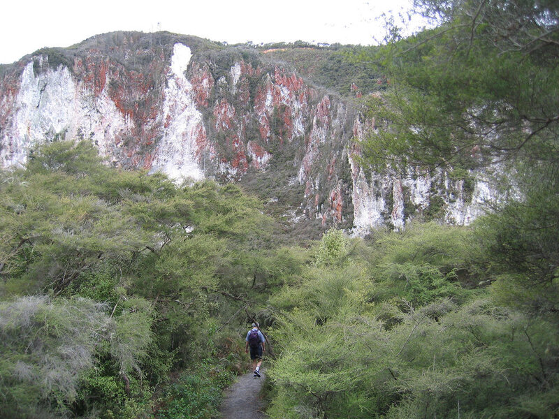 Hiker on trail near cliff