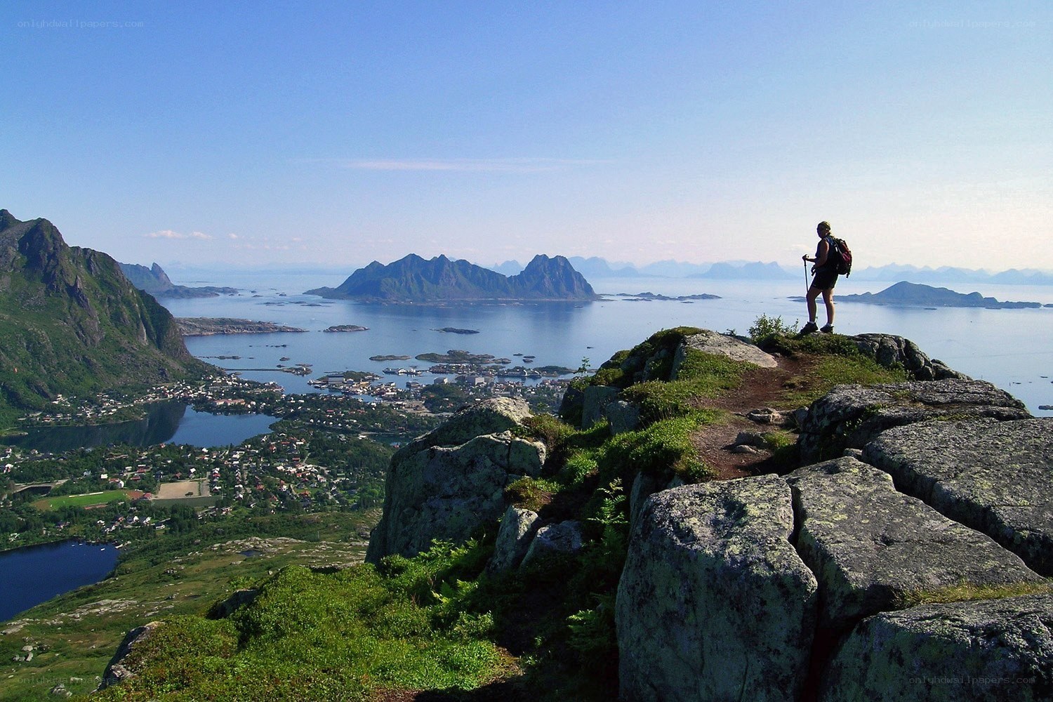 Hiker overlooking a coastal town