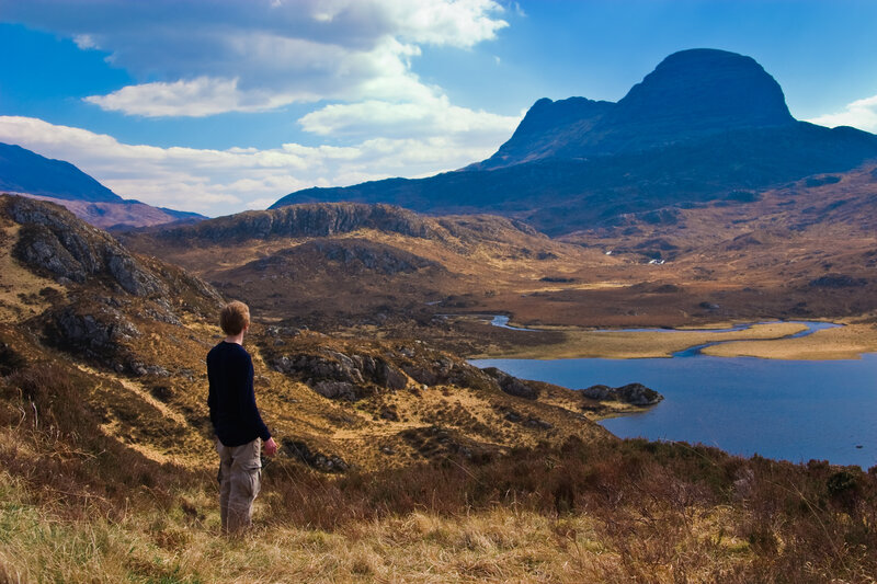 Hiker overlooking a mountain valley