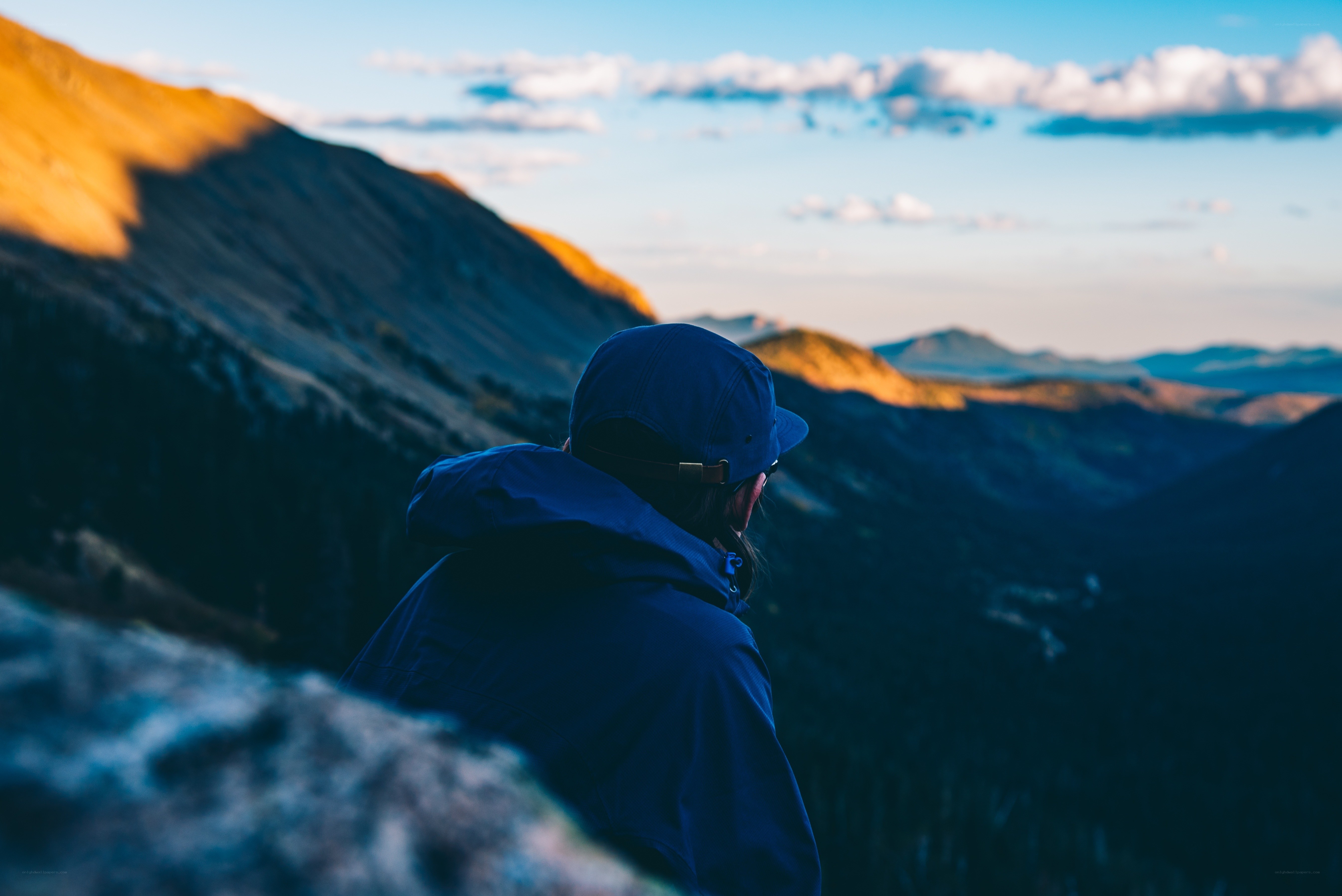 Hiker overlooking mountain valley