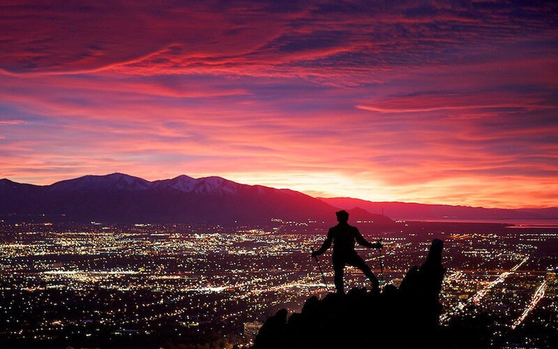Hiker silhouetted at sunset