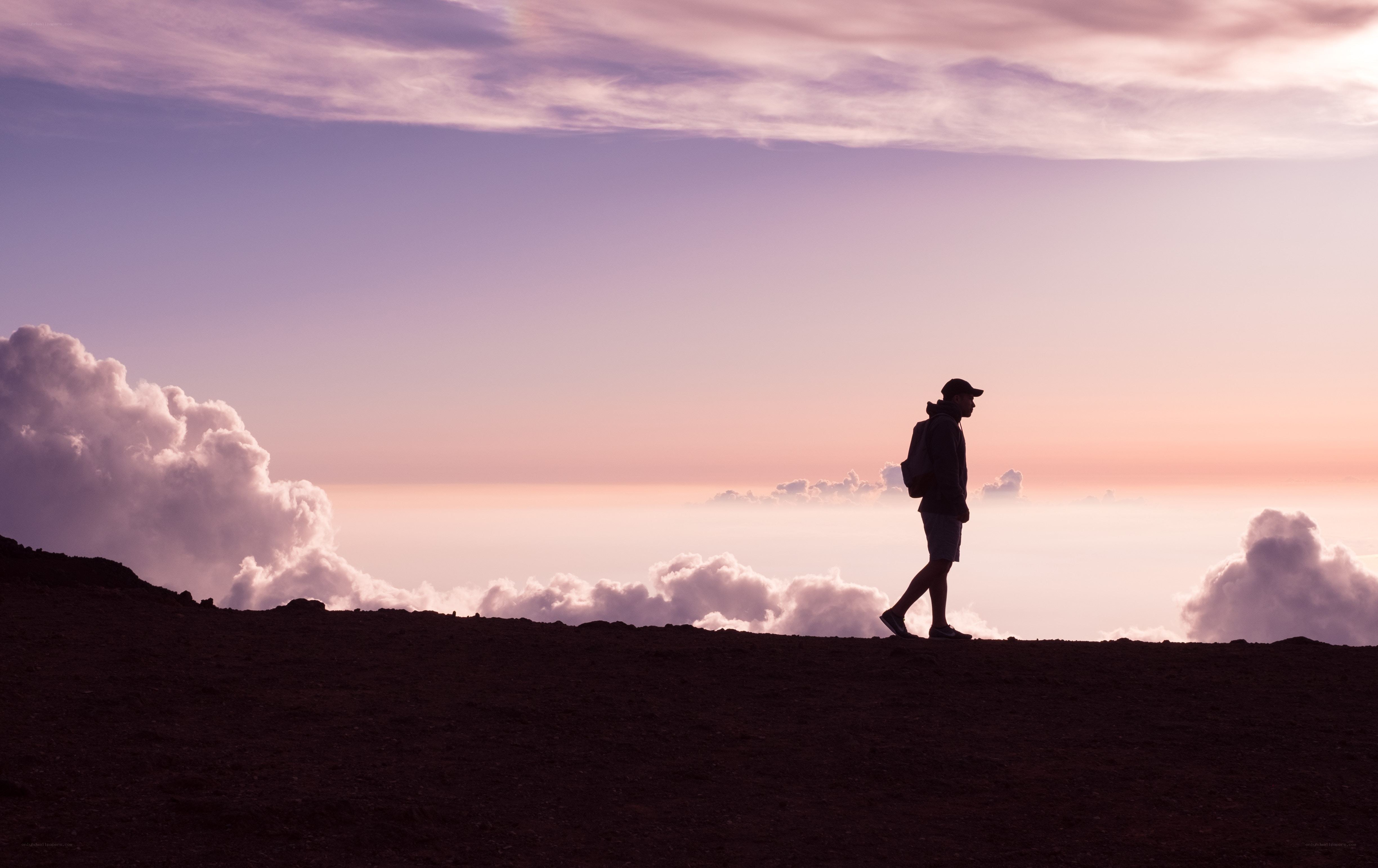 Hiker silhouetted at sunset