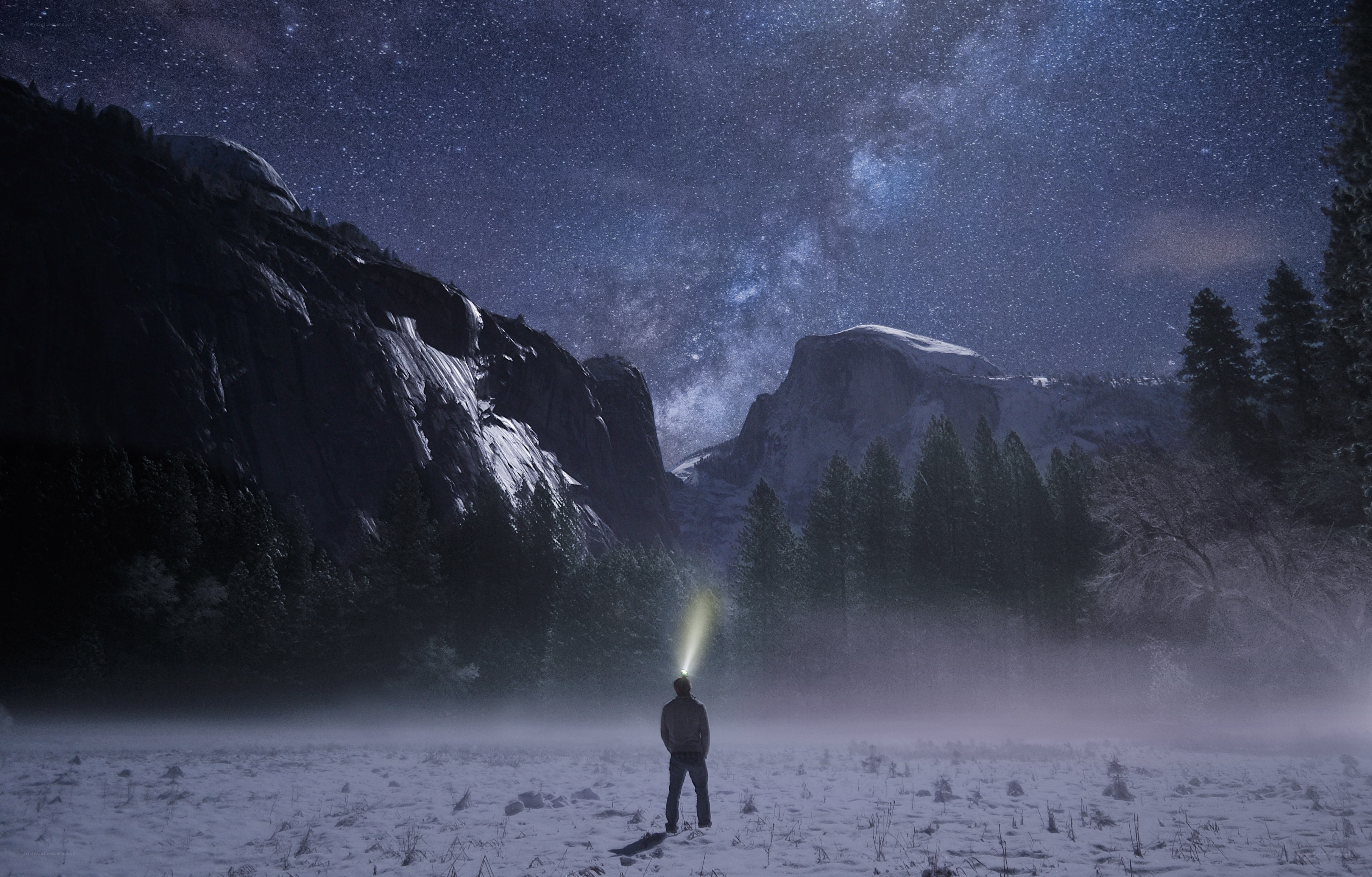 Hiker under starry sky
