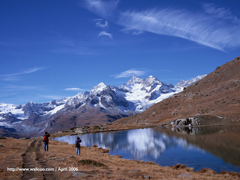 Hikers by a mountain lake