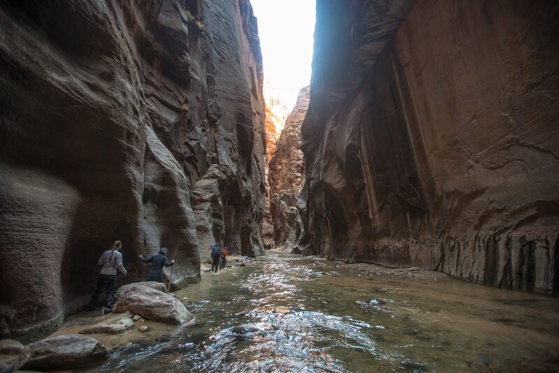 Hikers in a narrow canyon