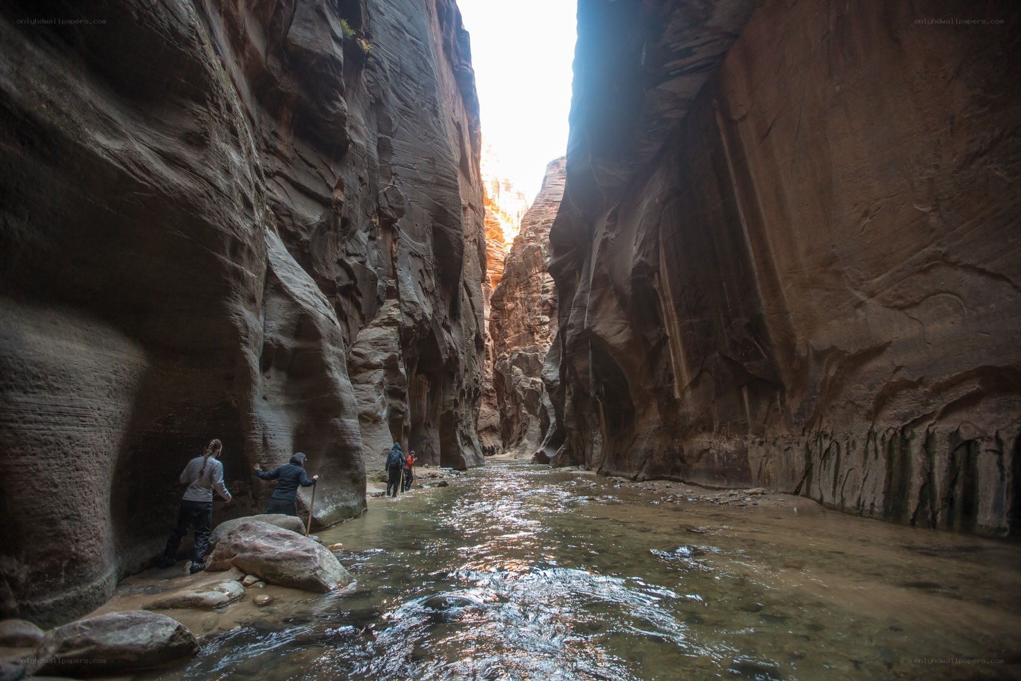 Hikers in a narrow canyon