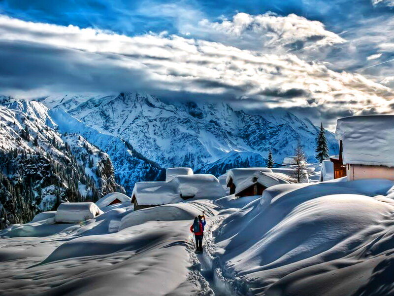 Hikers in Snowy Village