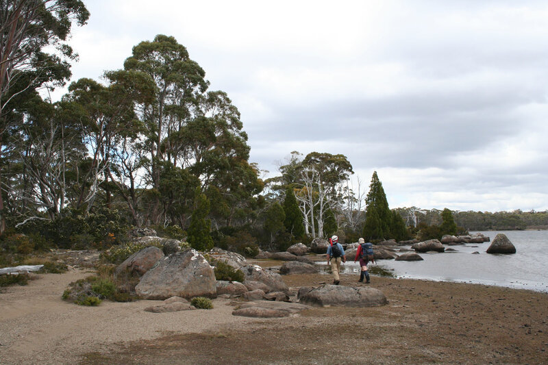 Hikers near a lake in Tasmania
