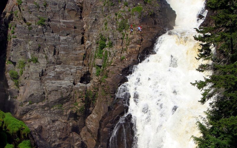 Hikers near a waterfall