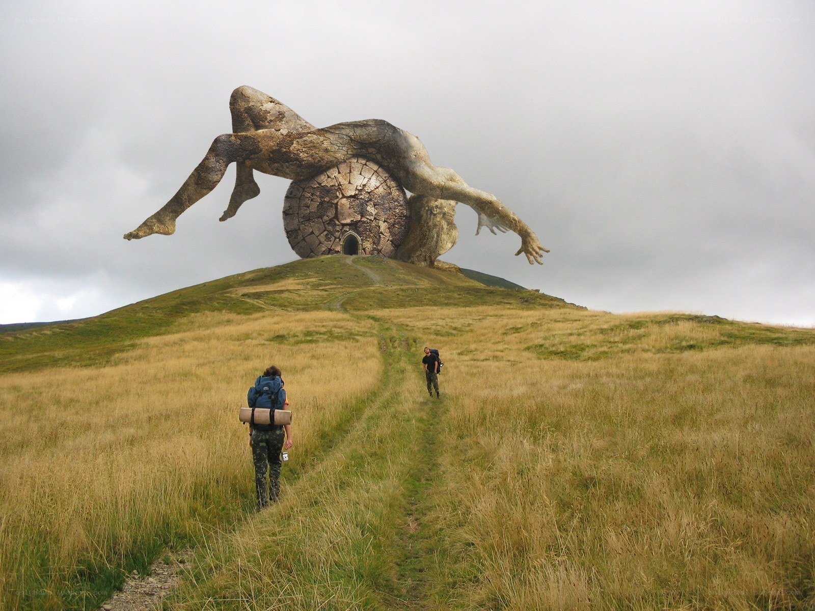 Hikers near giant statue