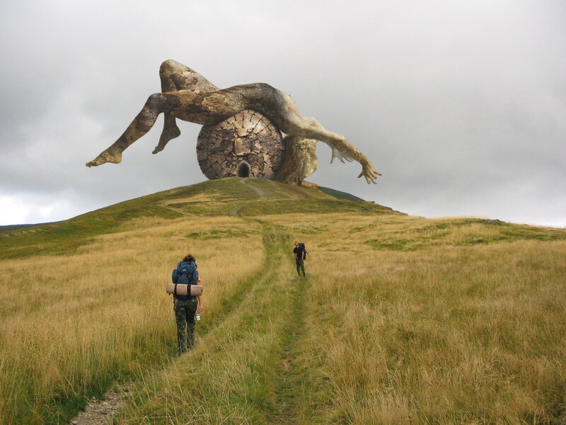 Hikers near giant statue