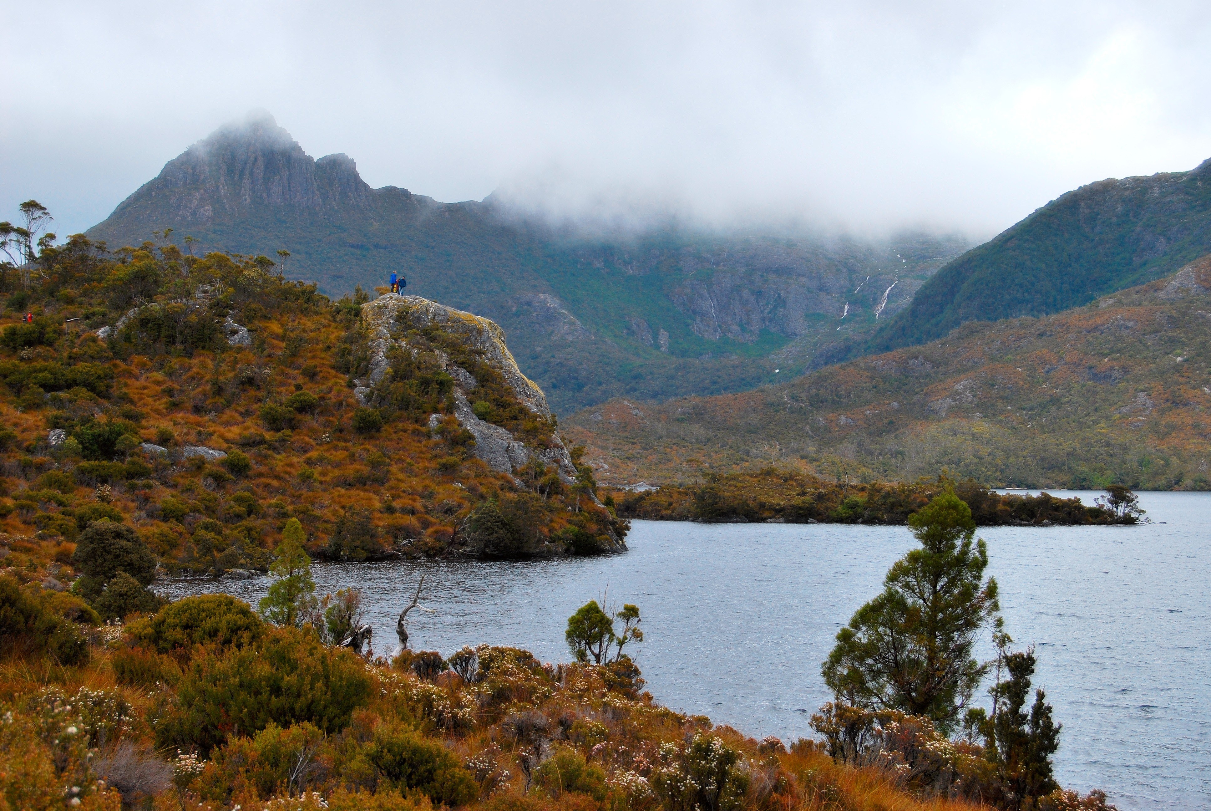 Hikers on a mountain lake