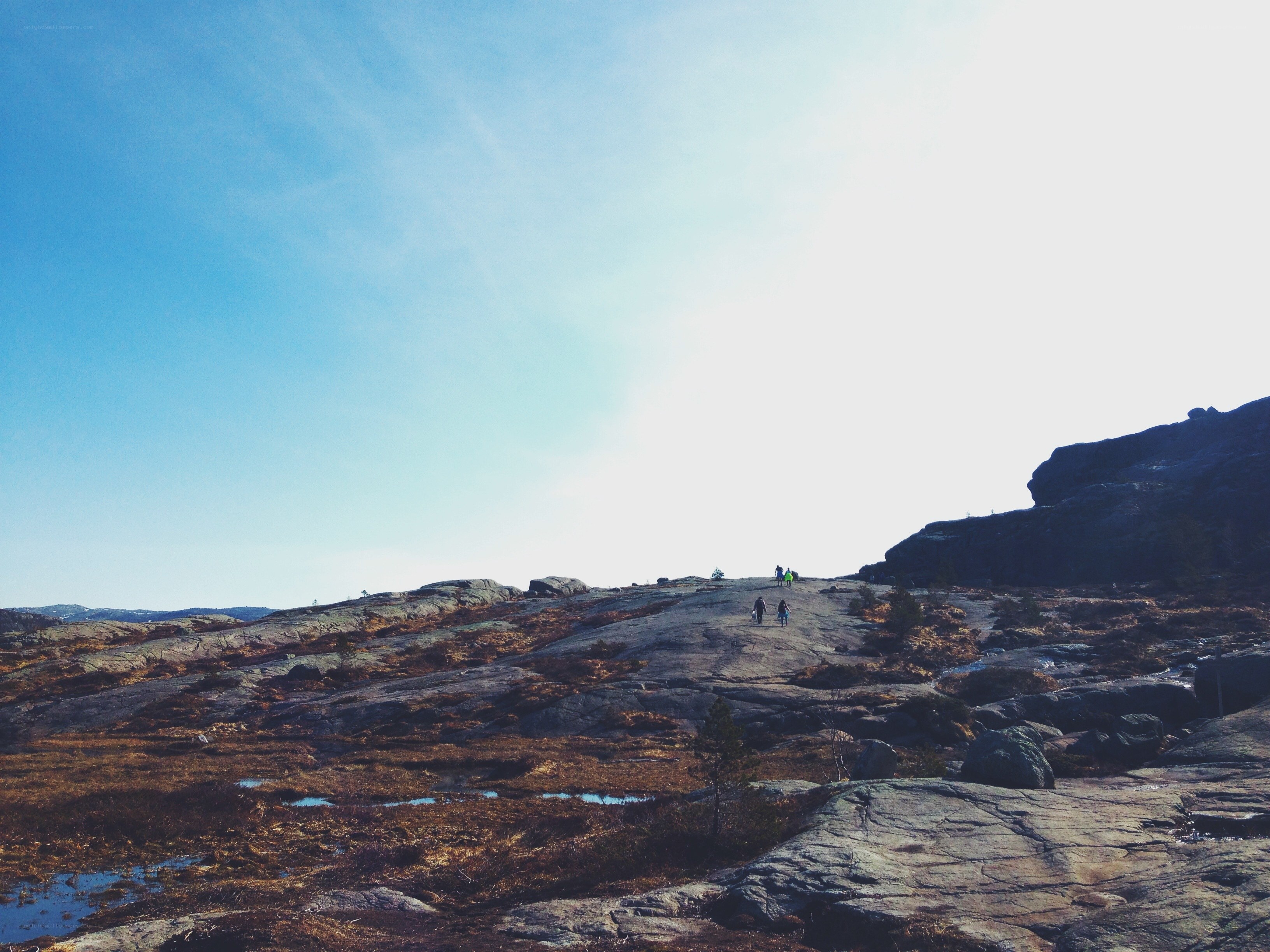 Hikers on a rocky hillside