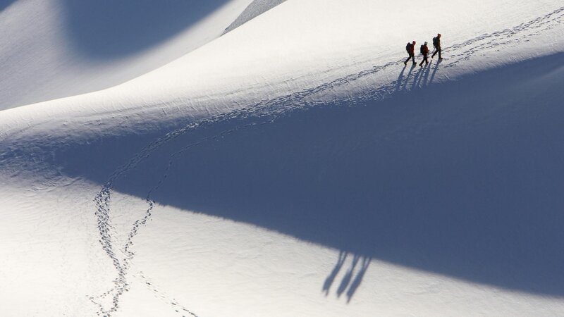 Hikers on a snowy mountain