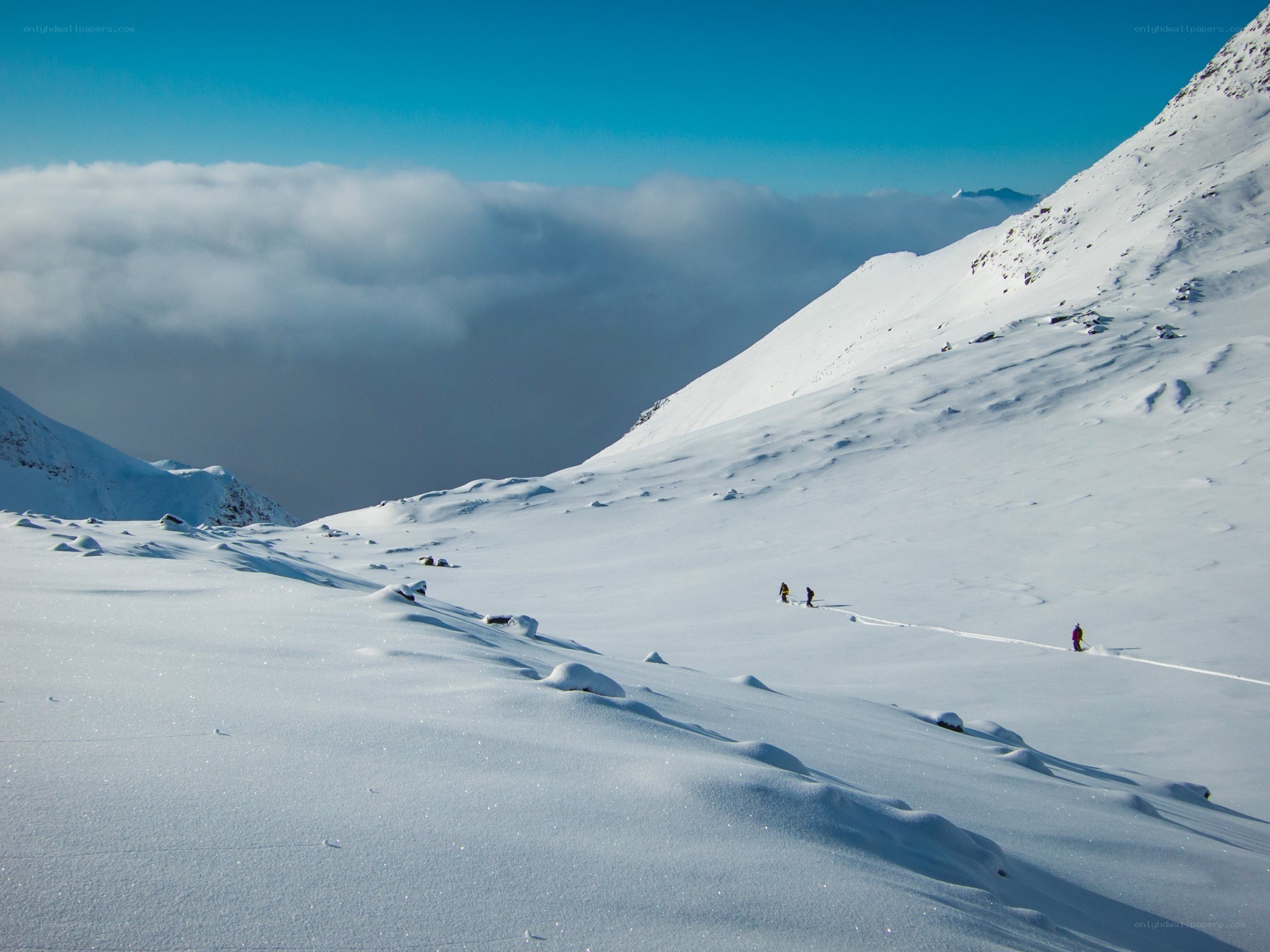 Hikers on a snowy mountain