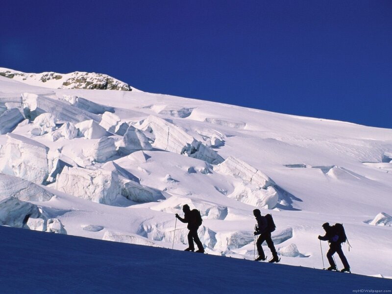 Hikers on a snowy mountain