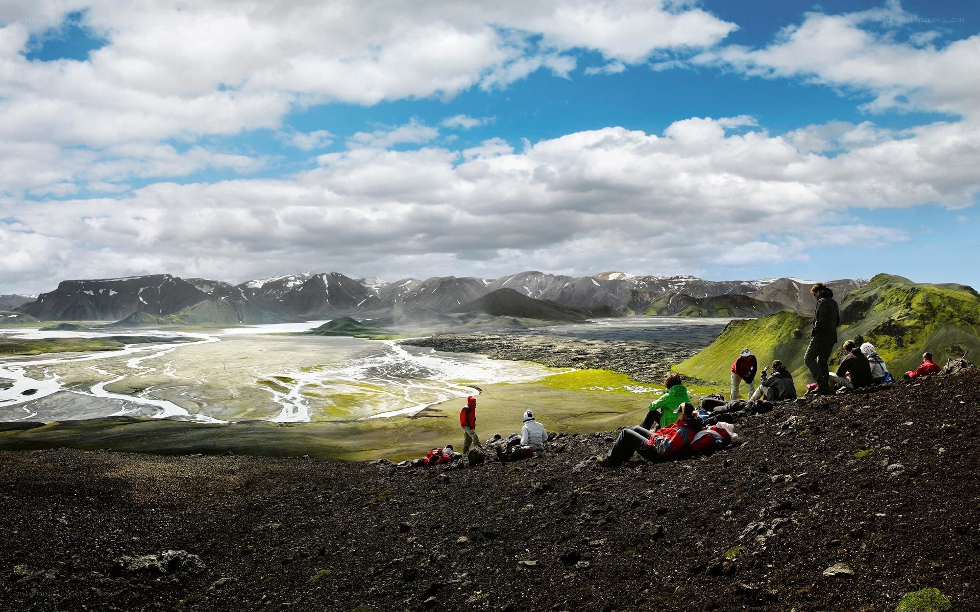 Hikers on a volcanic landscape