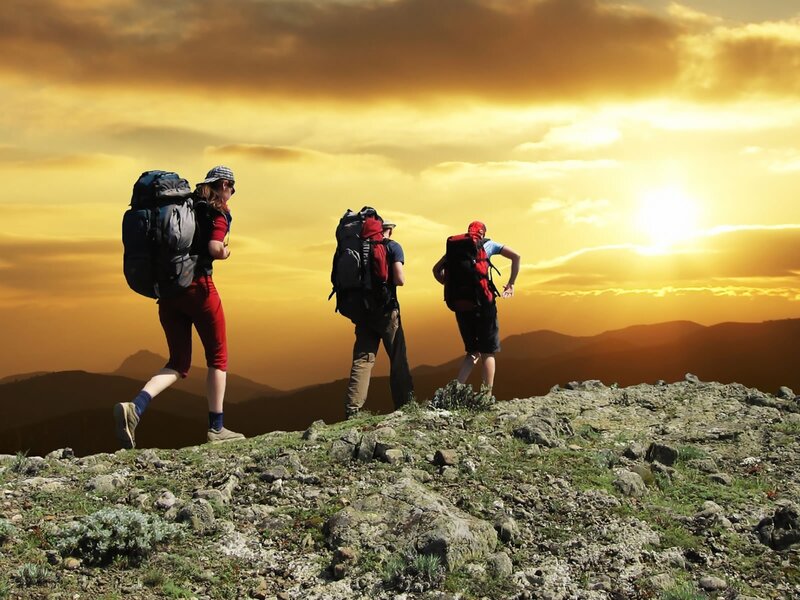 Hikers on Mountain Peak — Gold