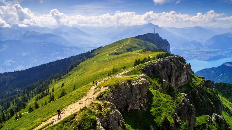 Hikers on Mountain Ridge — Green, Serene, Afternoon