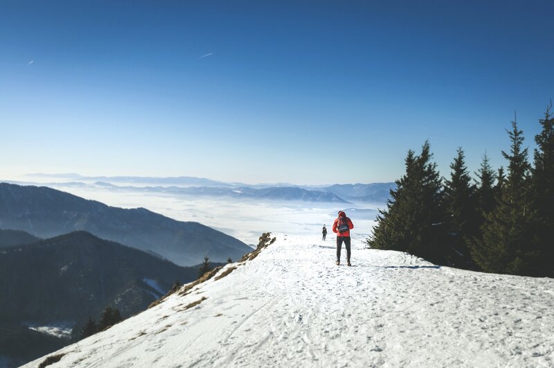 Hikers on Snowy Ridge