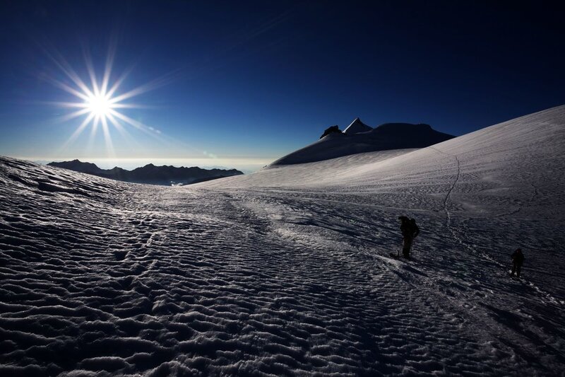 Hikers on Snowy Slope