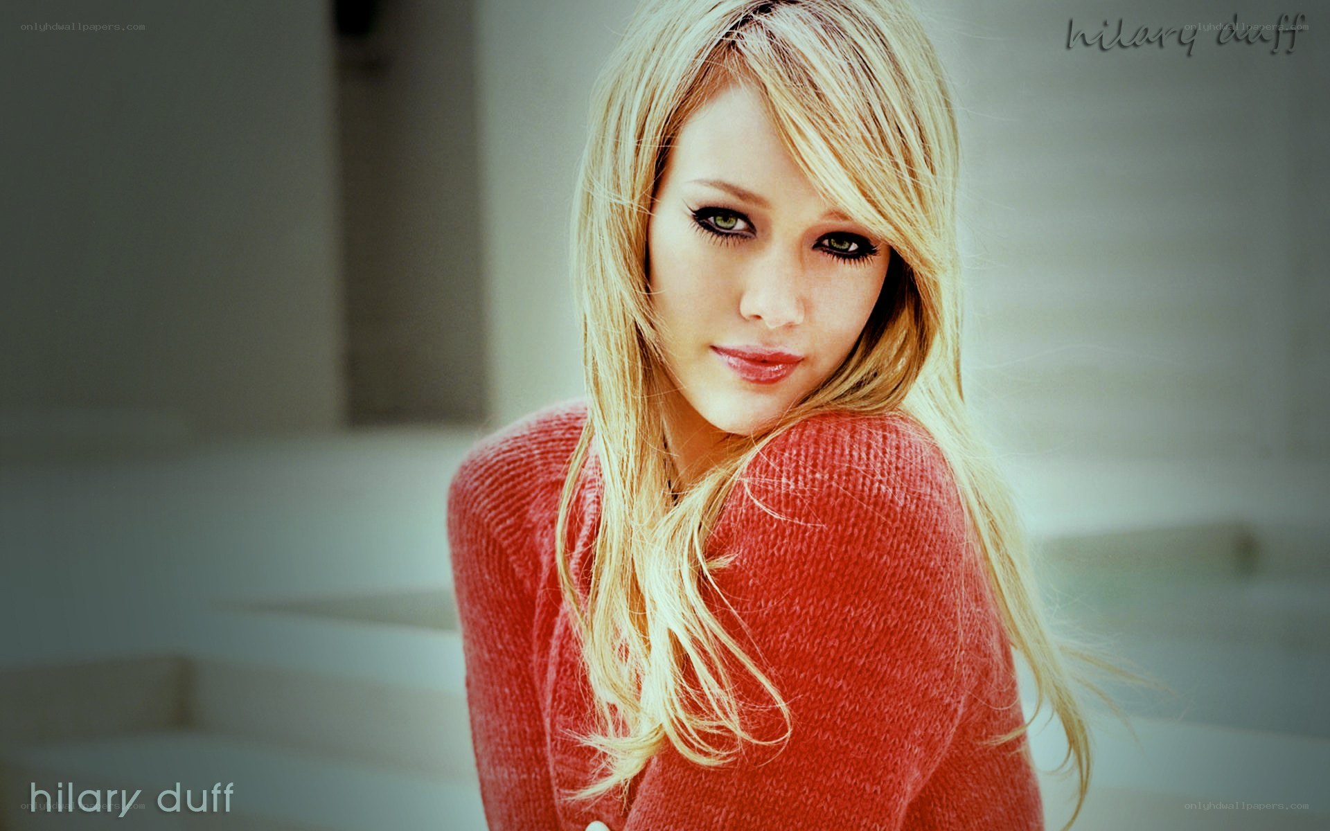 Hilary Duff in a red sweater