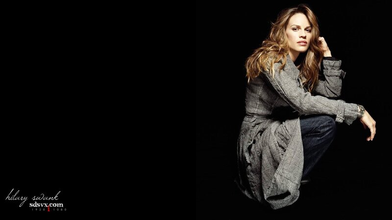 Hilary Swank in a plaid coat