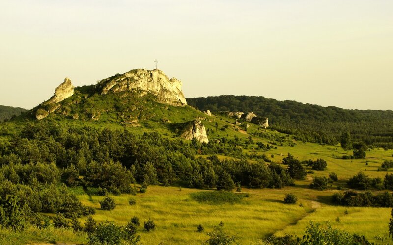 Hill with cross on rocky peak