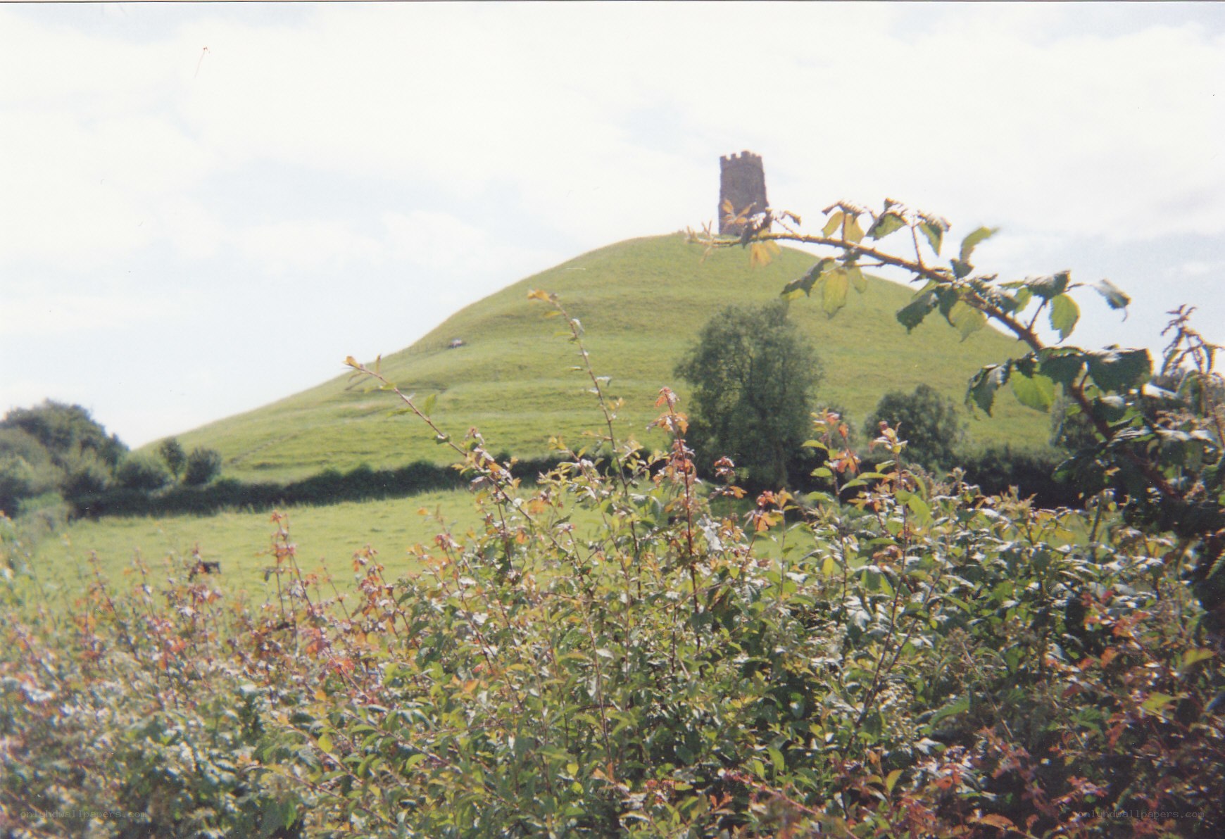 hill with tower in countryside