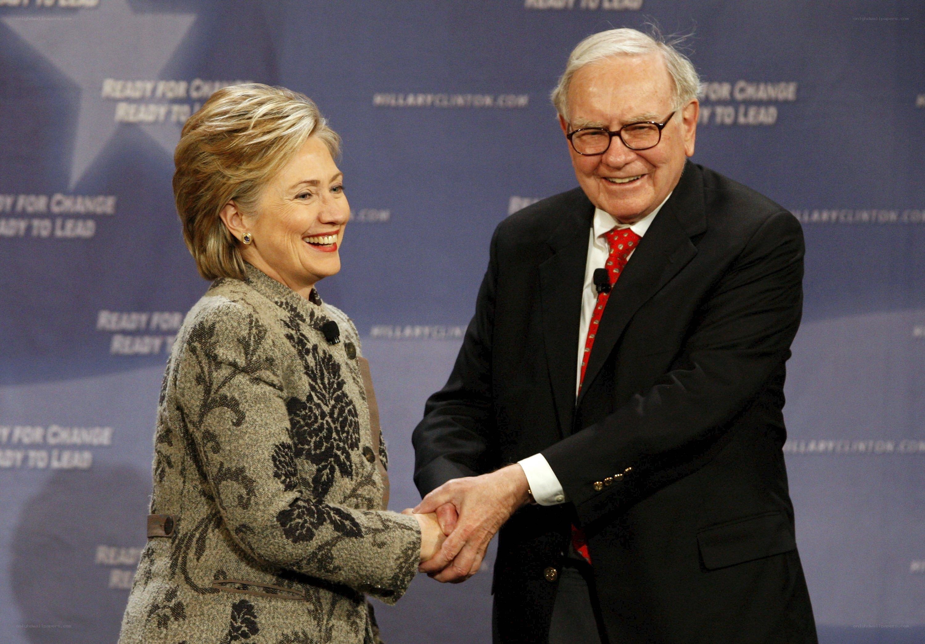 Hillary Clinton and Warren Buffett shaking hands