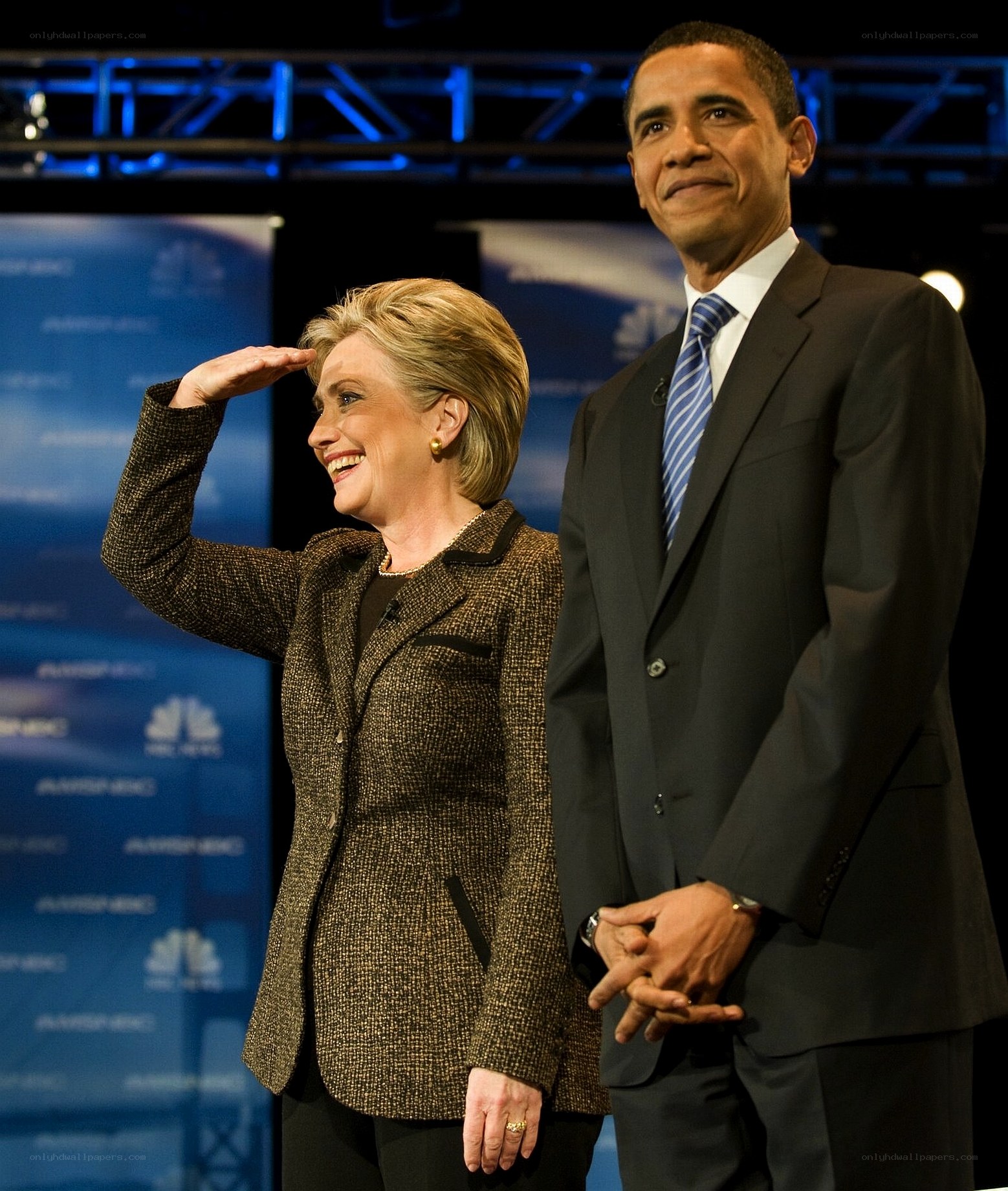Hillary Clinton saluting on stage