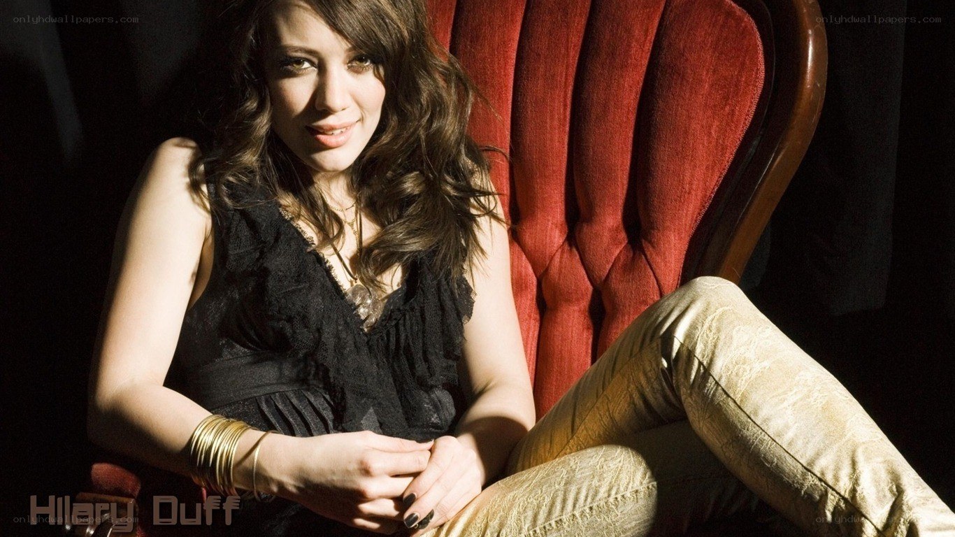 Hillary Duff in a red chair