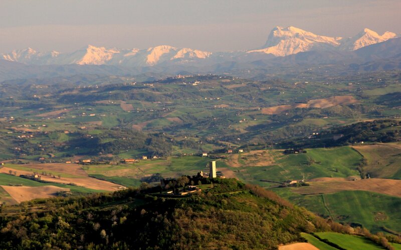 hills with snow-capped mountains