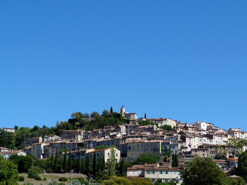 Hillside village under clear blue sky