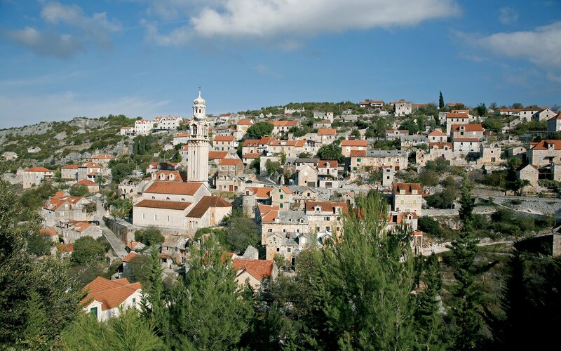 Hillside village with church