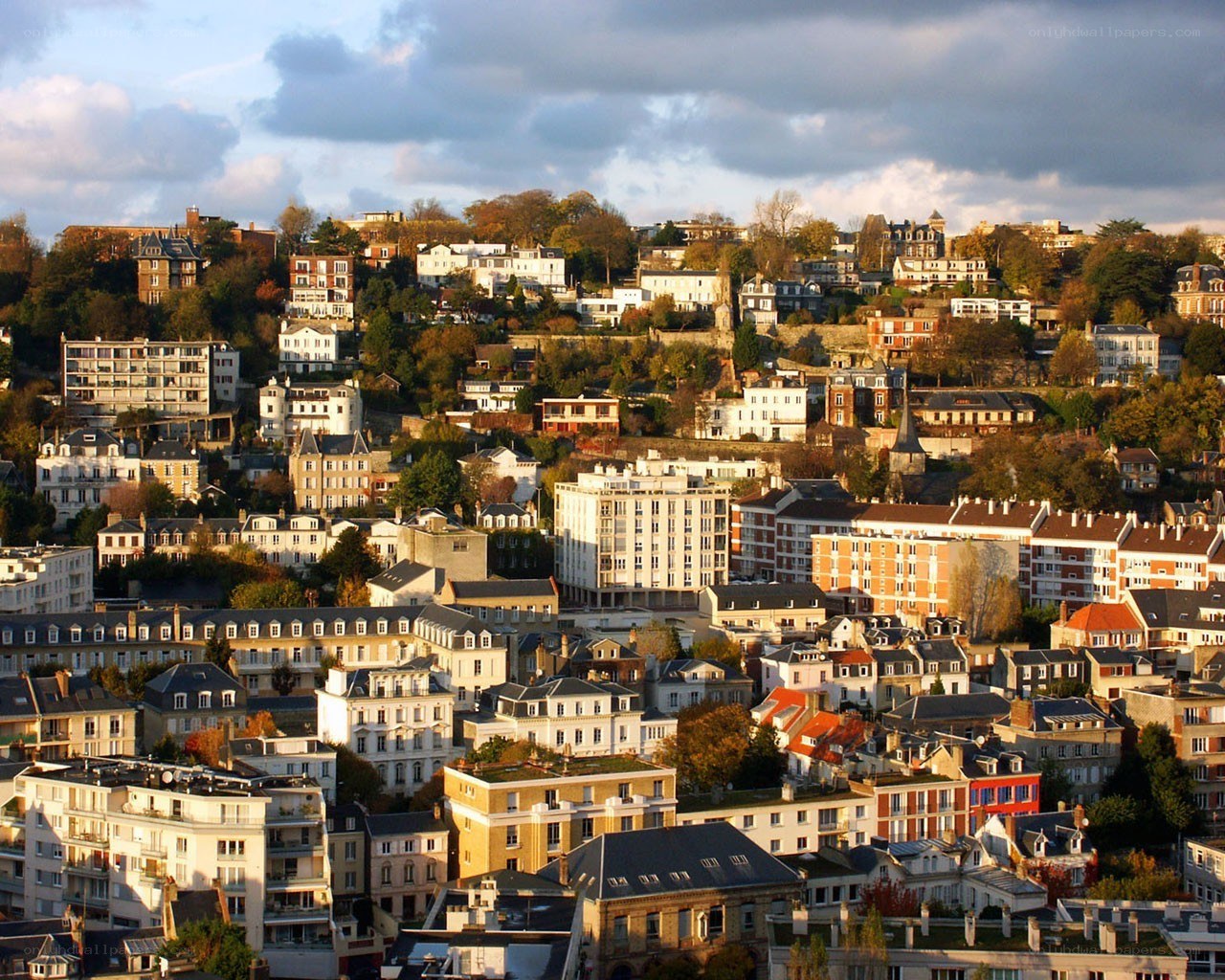 Hilly cityscape at sunset