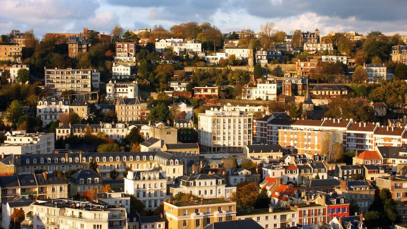 Hilly cityscape at sunset